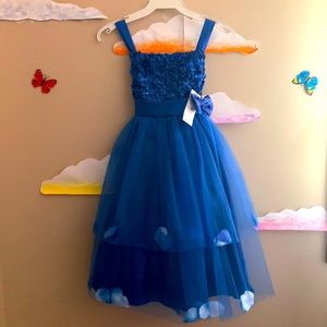 Blue dress with flower pedals.